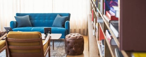 McDougall Energy acquires Vieira Fuels expanding customer base in Hamilton, Ontario 72 Shows living room with a blue couch against window and large book shelf to the right