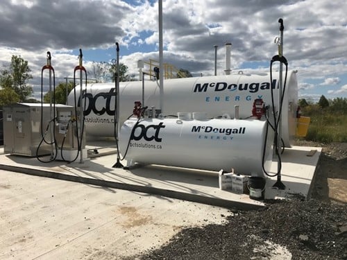 BCT Solutions fuels up with the help of McDougall Energy 115 Shows outdoor shot of large white tank with Mcdougall Energy logo on it and BCT logo