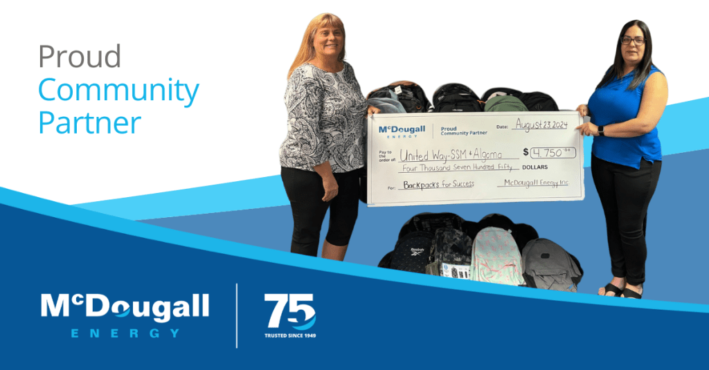 McDougall Energy Donates Backpacks to Local Students in Need 19 Photo of McDougall Energy representative with the United Way for a cheque presentation