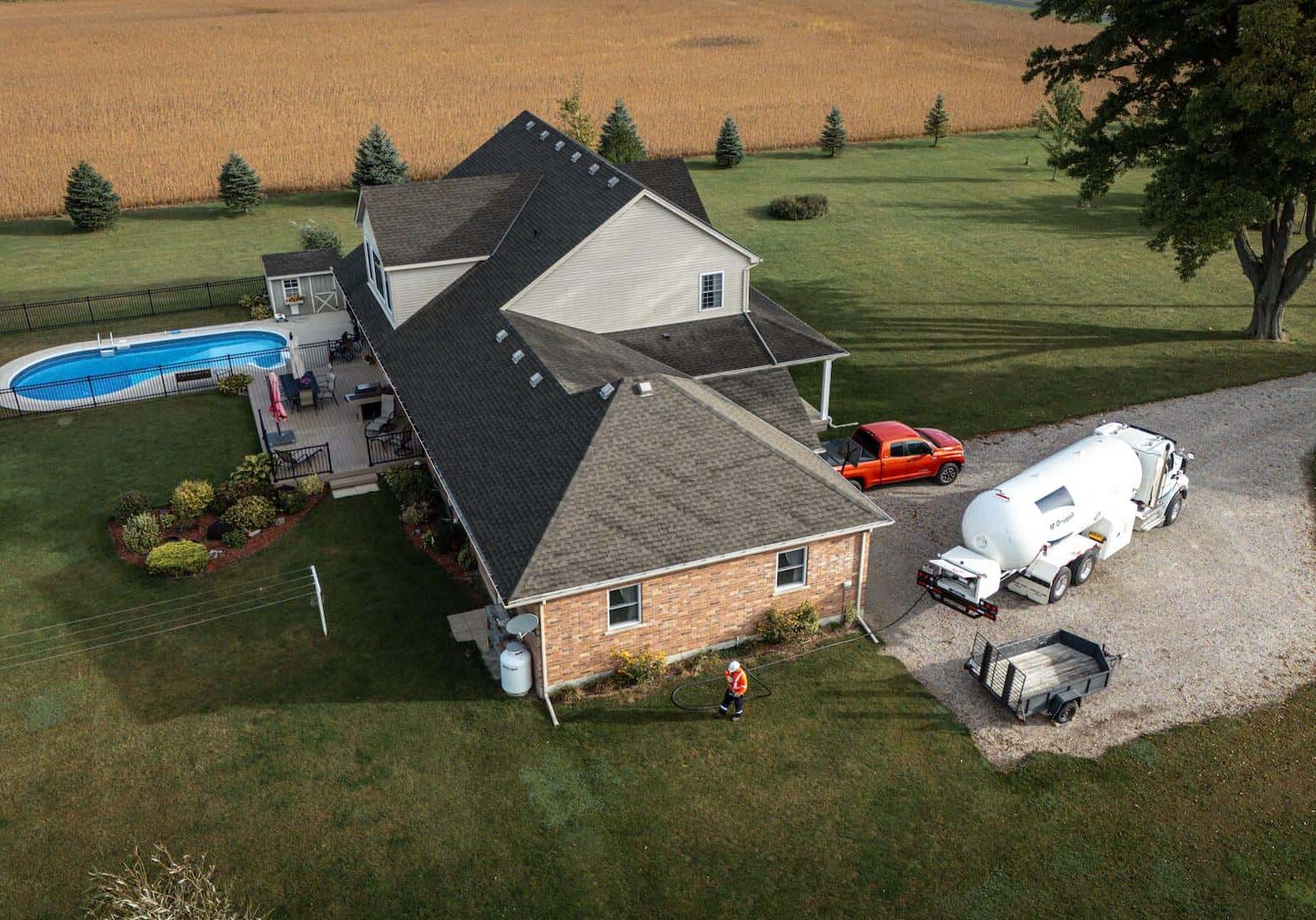 Clean Energy Home with Petroleum Tanker and Fuel Delivery Service near a Pool.