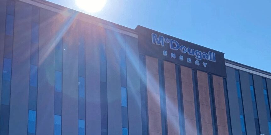 Sun shining on corporate building with many windows