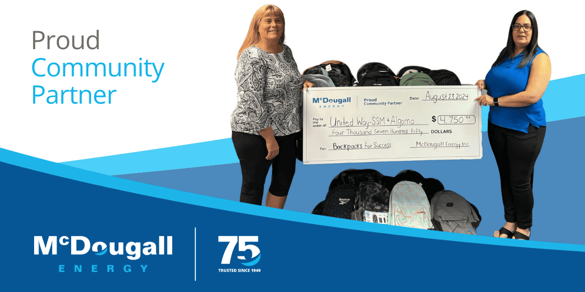 Photo of McDougall Energy representative with the United Way for a cheque presentation