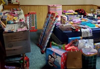 Shows a room filled with donations and gifts