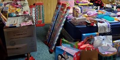 Shows a room filled with donations and gifts