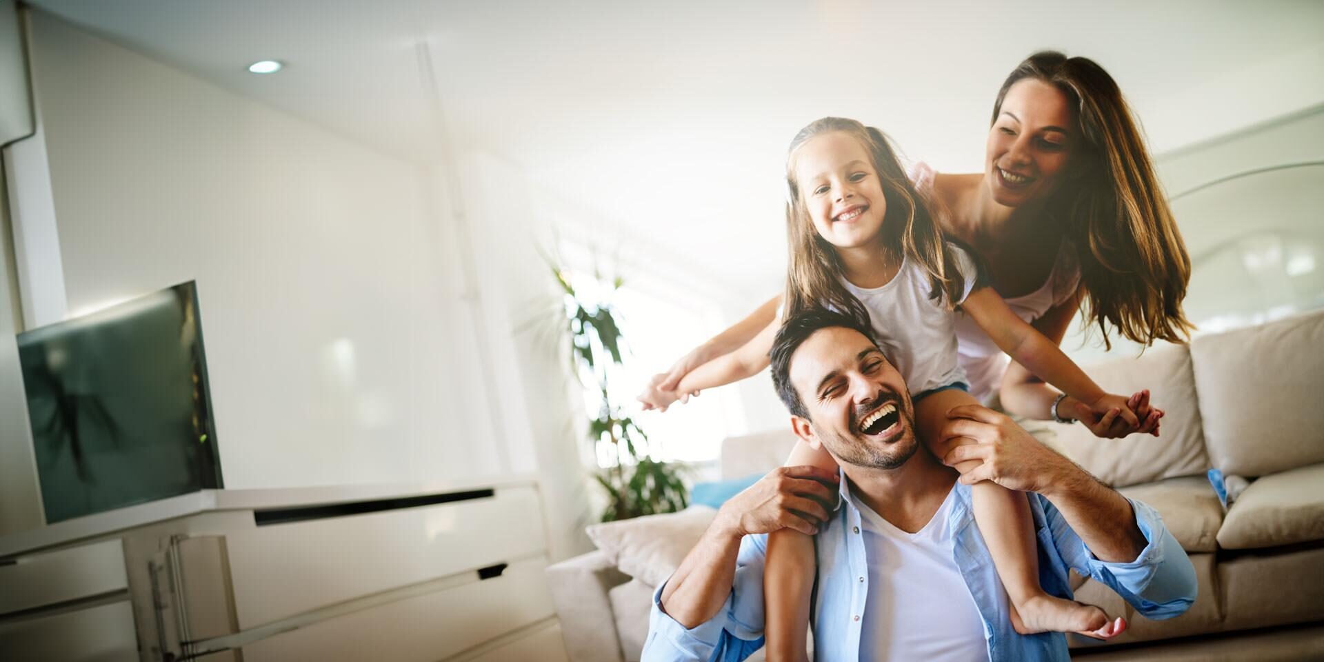 Happy family having fun times at home together