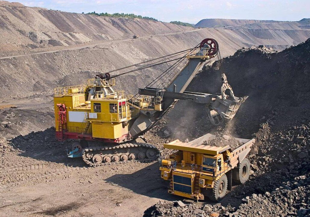 A picture of a big yellow mining truck at worksite
