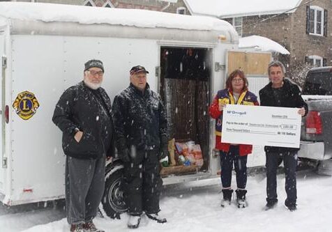 Struggling winter weather donation event at McDougall Energy with community support.