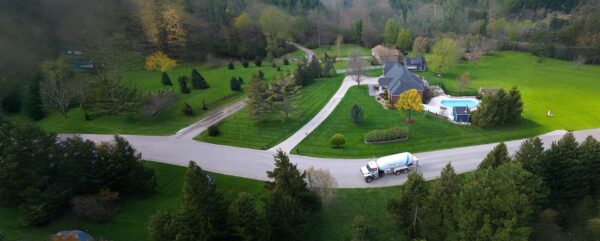 Oil delivery truck at a residential property, home heating, fuel delivery, McDougall Energy services.