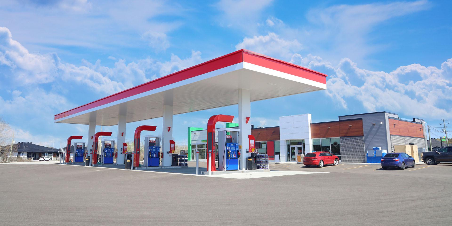 Home 3 Modern Service Station with convenience store and a few cars, in a Sunny Day