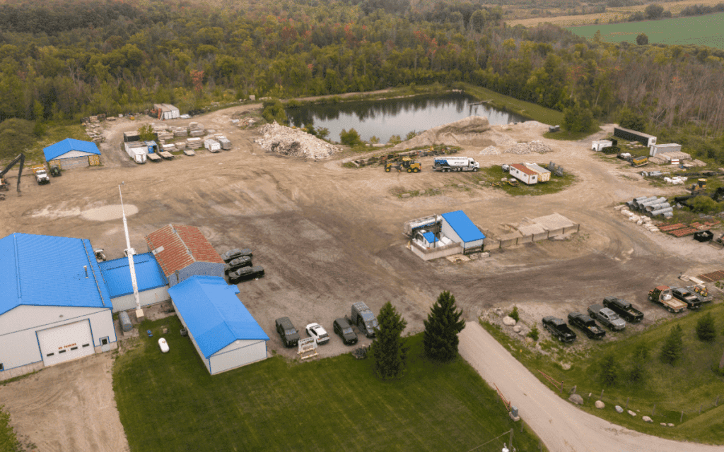High-capacity fuel and energy supply facility with Blue-roofed buildings and fuel trucks.