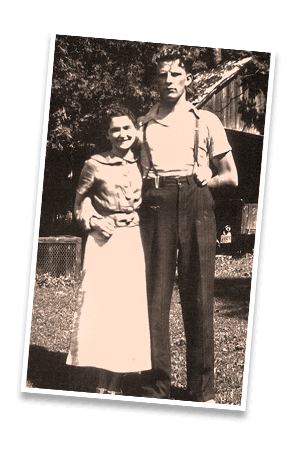 1. Vintage black and white photo of a woman and man outdoors, reminiscent of mid-20th century.