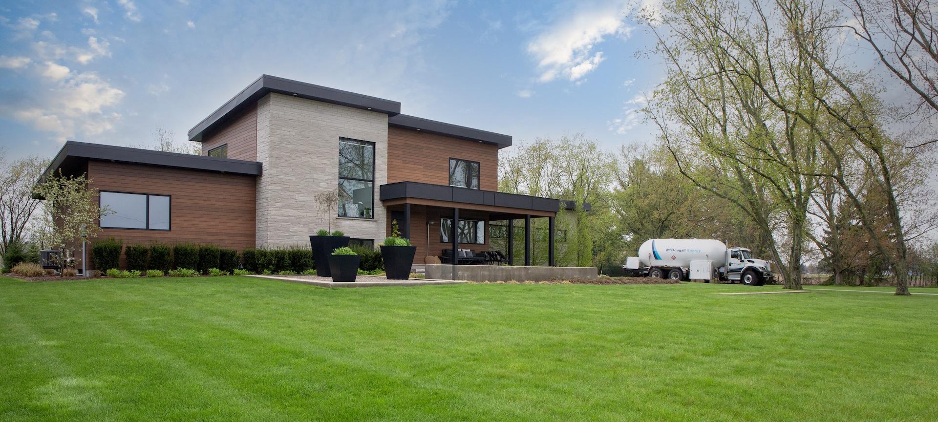 Home 1 Modern house with green lawn and McDougall truck